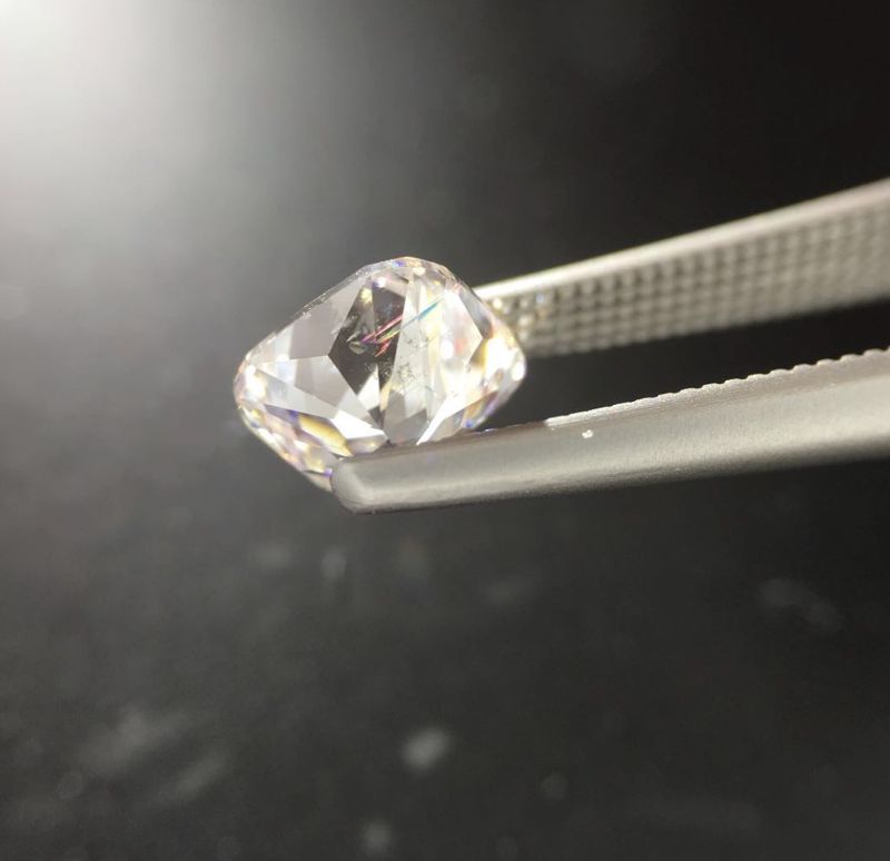 One of the fracture-filled diamonds handled by a jeweler.