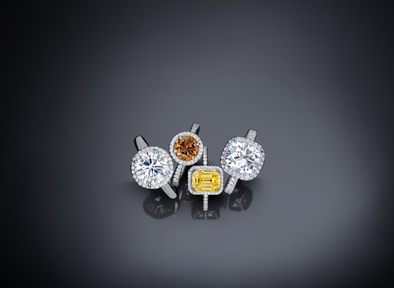 White and colored treated diamonds set in white gold rings