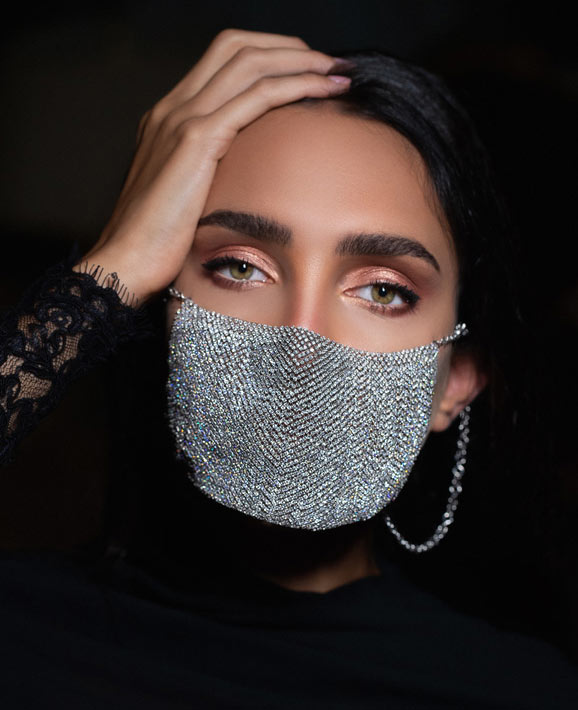 Woman wearing diamonds on her mask