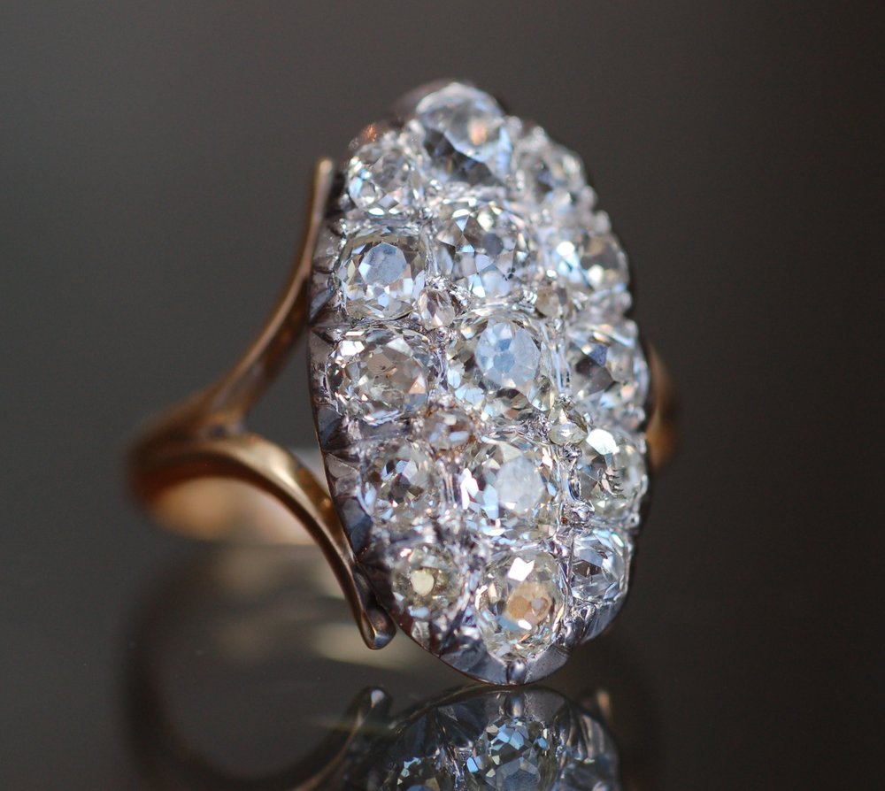 An antique diamond ring set in gold