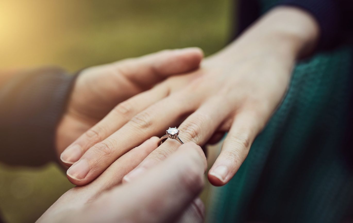 A wedding proposal with an heirloom engagement ring.
