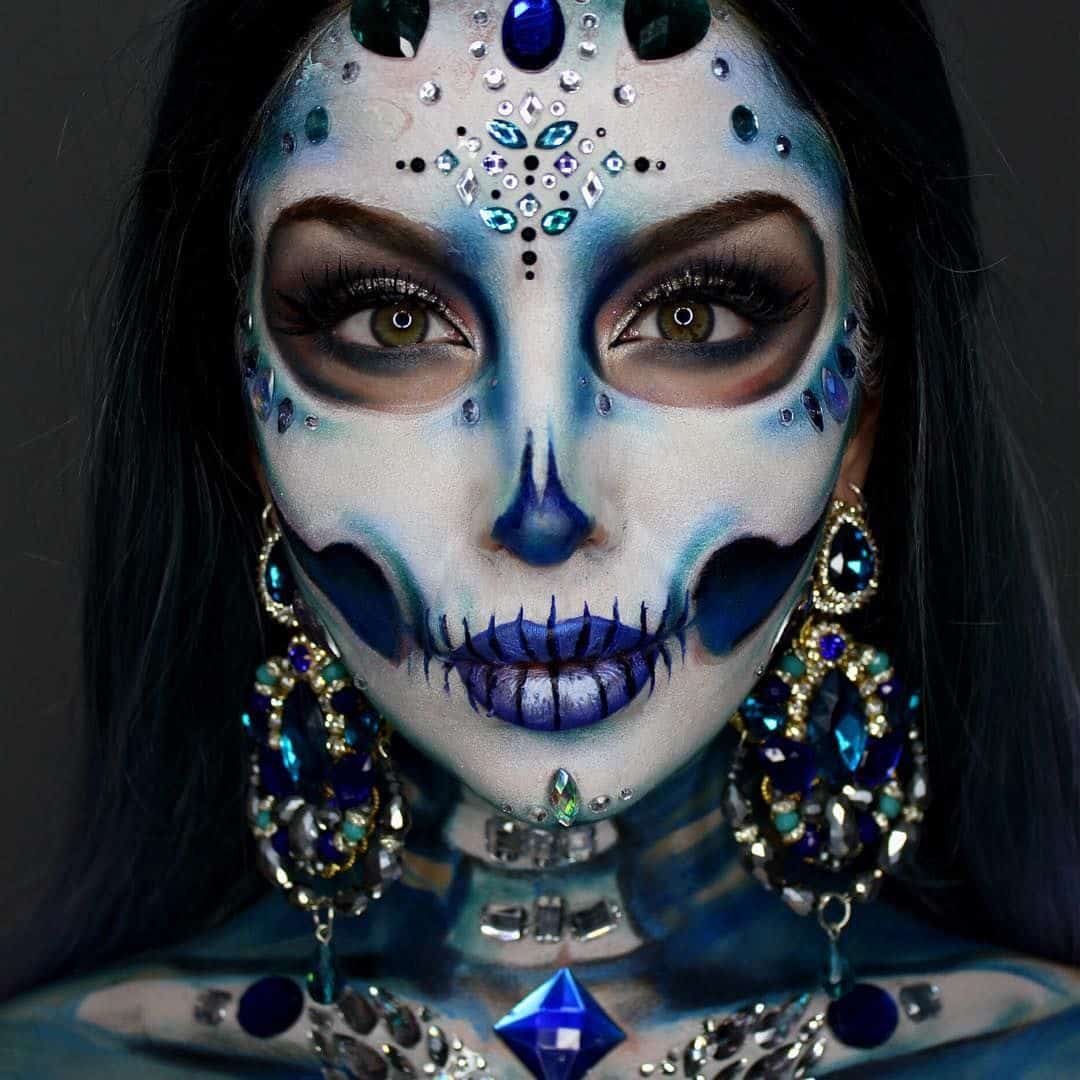 A woman with a diamond-inspired Halloween makeup