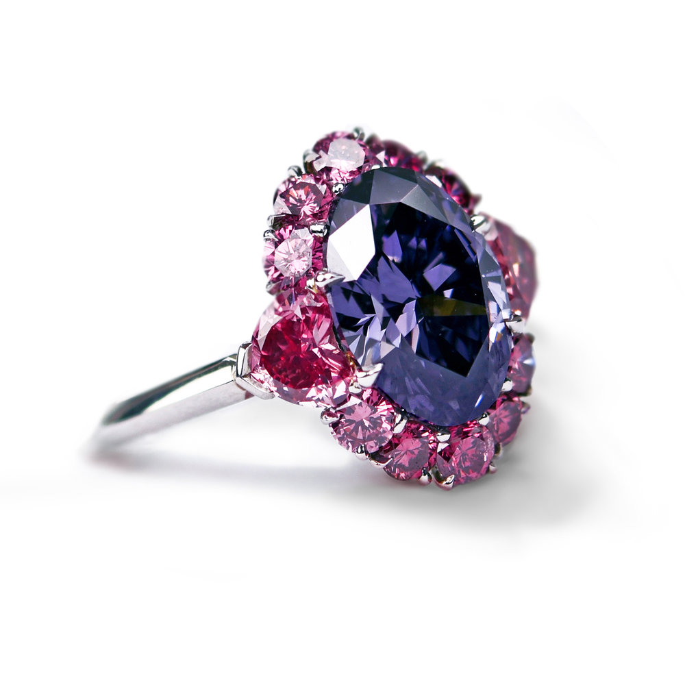 Purple diamond surrounded by pink diamonds, set in platinum