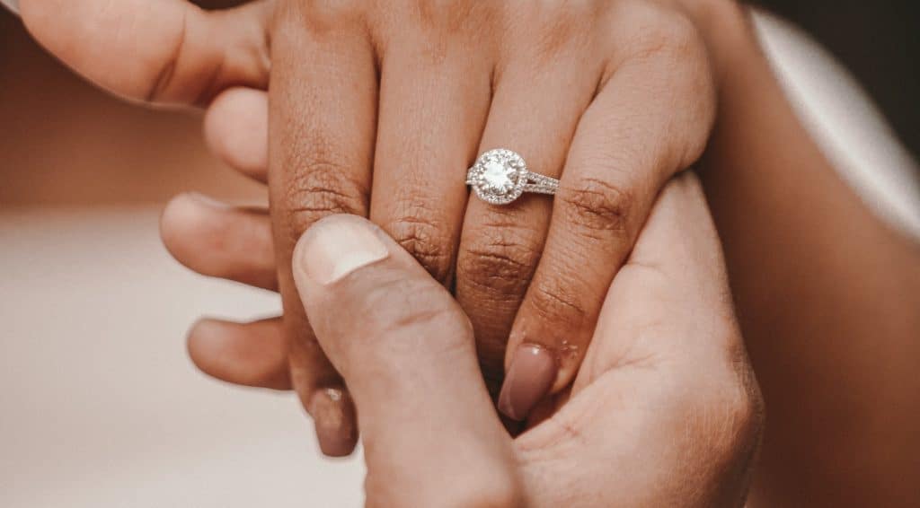 A woman who just accepted a precious ring from her fiance.