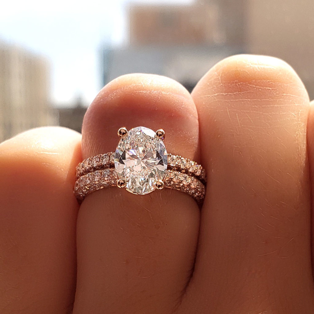 Wearing a stunning diamond engagement ring.