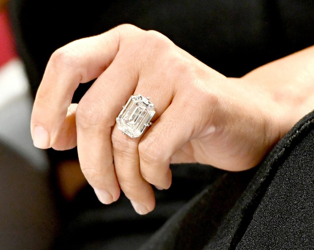 A woman with a large, diamond engagement ring.